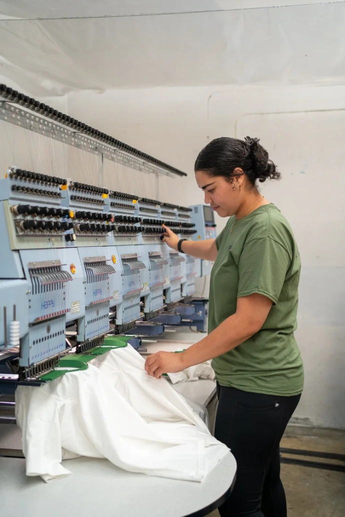 Logo embroidery on a garment at Amba Branding, Petone